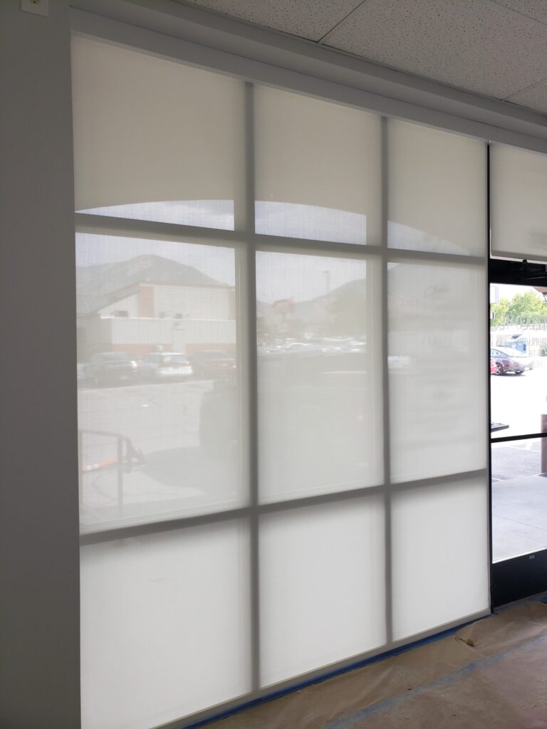 Office entrance with full length white window shades