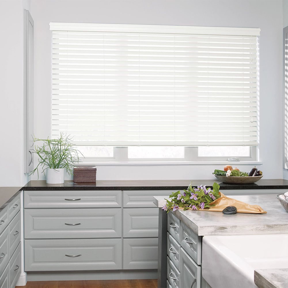 Blinds on a window in a white kitchen