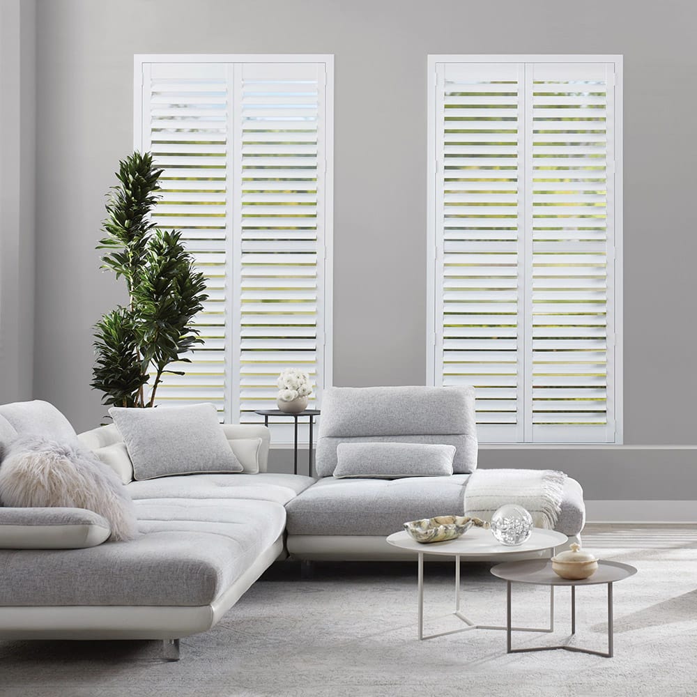 Wood shutters on windows in living room